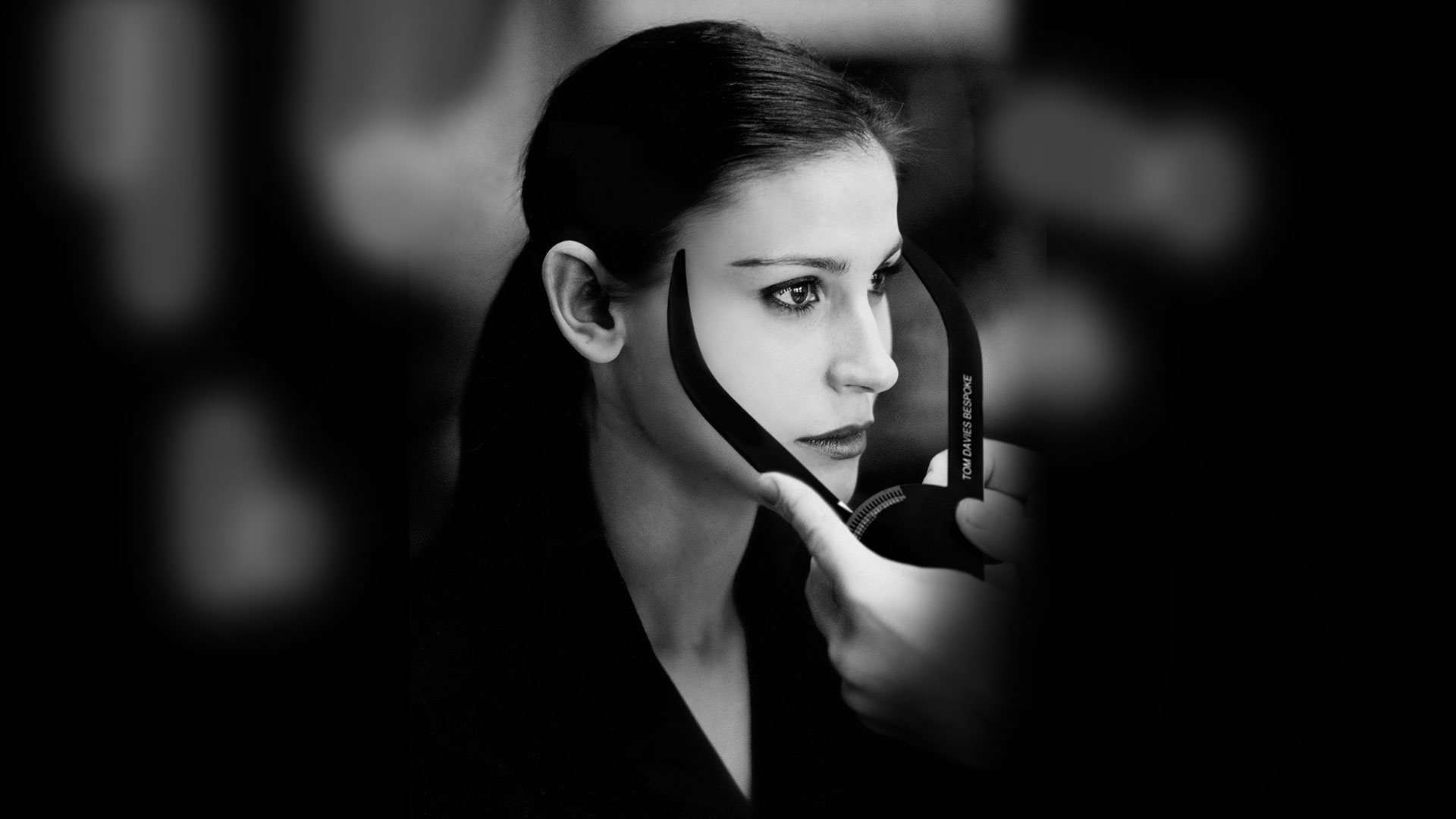 Female Tom Davies customer has her facial measurements taken with a caliper