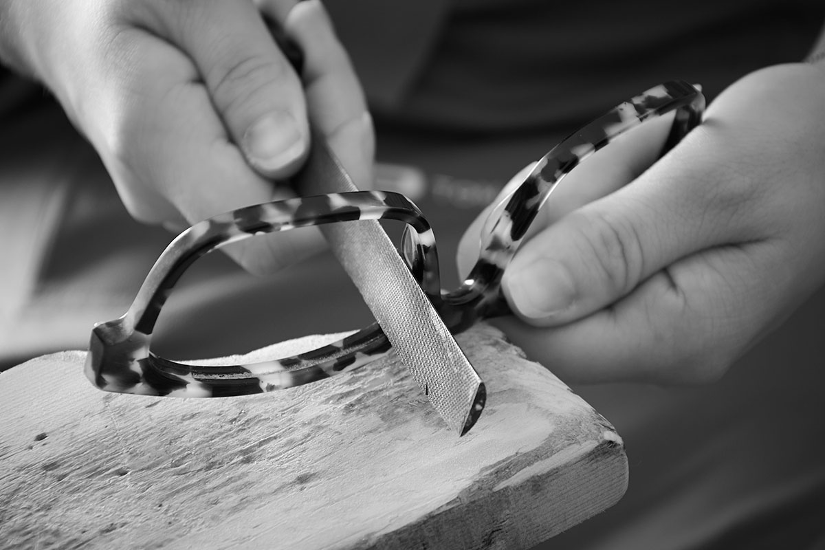 Acetate frames being filed by hand in the Tom Davies London factory