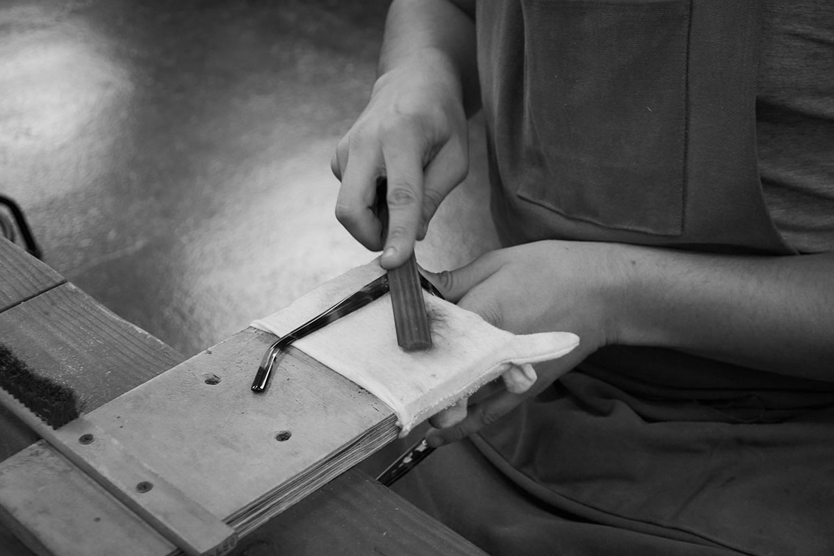 Temple arm of a Tom Davies frame being filed by hand