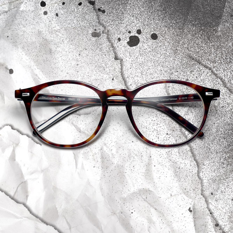 Emma Stone as Estella wears glasses in Disney's Cruella, designed by Tom Davies.