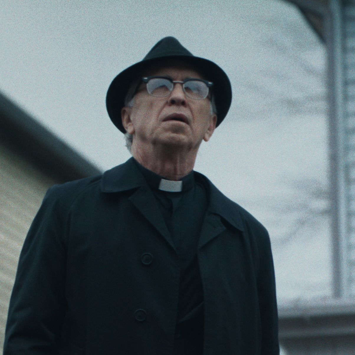 Father Gordon wears Tom Davies retro titanium and acetate combination frames.